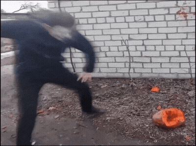 Person Kicking Pumpkin In Dirt GIF