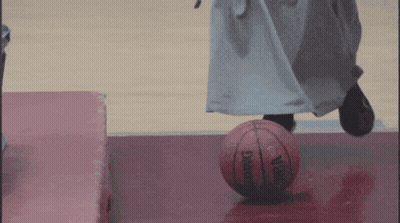 Person Kicking Spalding Basketball On Court GIF