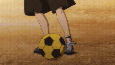 Person Kicking Yellow And Black Soccer Ball On Dirt Field GIF