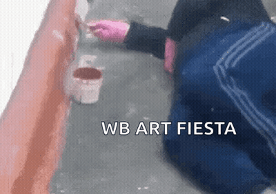 Person Kneeling While Painting Wall With Brush GIF