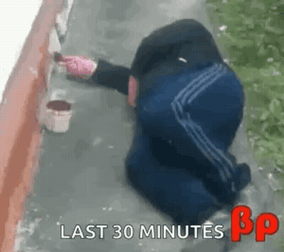Person Kneeling While Painting Wall GIF