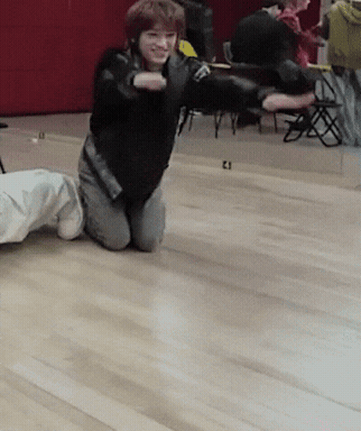 Person Kneeling With Number 21 GIF