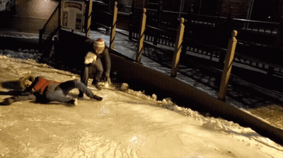 Person Laying In Front Of Ice Skating Sign GIF
