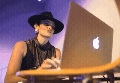 Person Laying In Grass With Laptop Saying Whats A Computer GIF