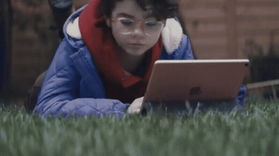 Person Laying In Grass With Laptop Saying Whats A Computer GIF