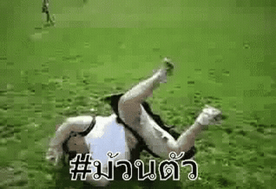 Person Laying On Back In Grass On Soccer Field GIF