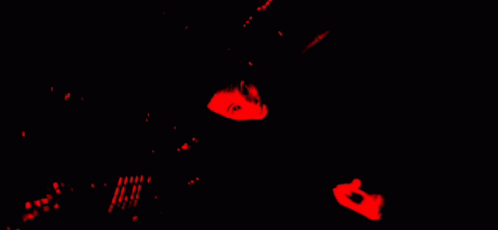 Person Laying On Back With Red Background And Black Shirt Saying Evil GIF