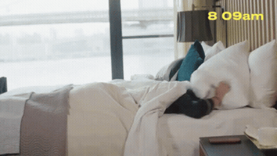 Person Laying On Bed At 8:09 GIF
