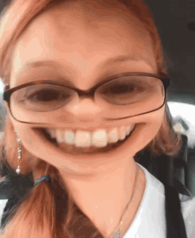 Person Laying On Bed Phone Plugged In Ear GIF