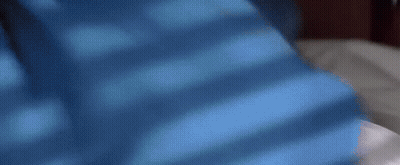 Person Laying On Bed With Blue Background GIF