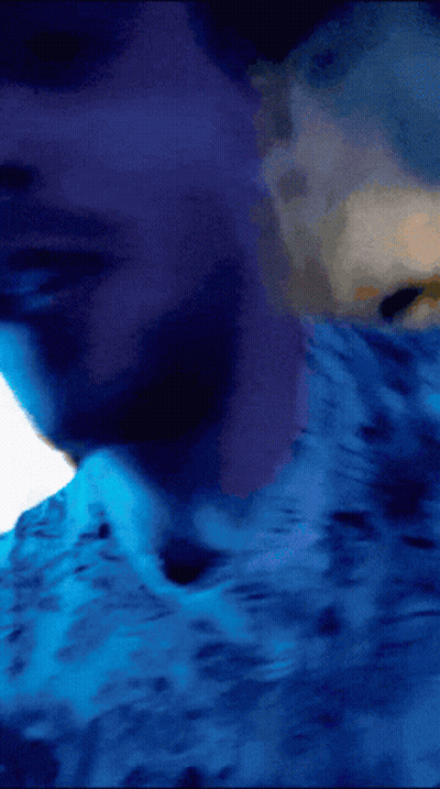 Person Laying On Bed With Blue Sheets GIF