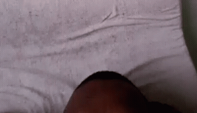 Person Laying On Bed With Eyes Closed GIF
