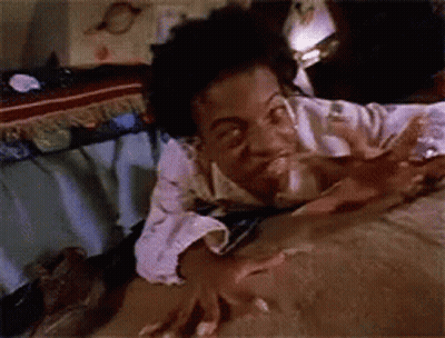 Person Laying On Bed With Hands On Blanket GIF