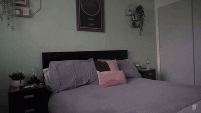 Person Laying On Bed With Starry Night Picture GIF