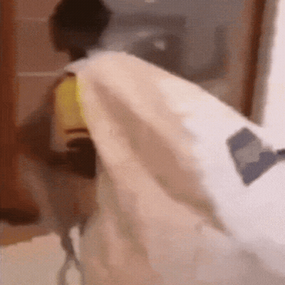 Person Laying On Bed With White Blanket GIF