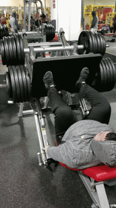 Person Laying On Bench With Leg Press Machine GIF