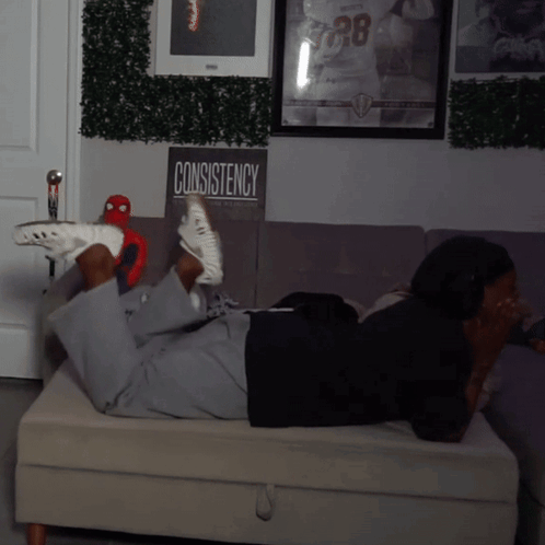 Person Laying On Couch With Consistency Sign GIF