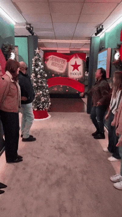 Person Laying On Floor In Front Of Red Cross GIF