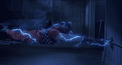 Person Laying On Floor With Lightning From Hands GIF