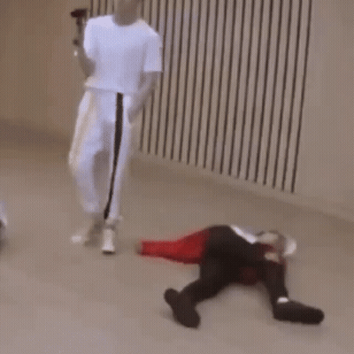 Person Laying On Floor With Man Holding Microphone GIF