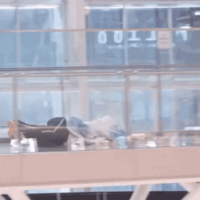 Person Laying On Glass Floor GIF