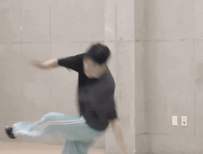 Person Laying On Green Mat With Chinese Writing GIF