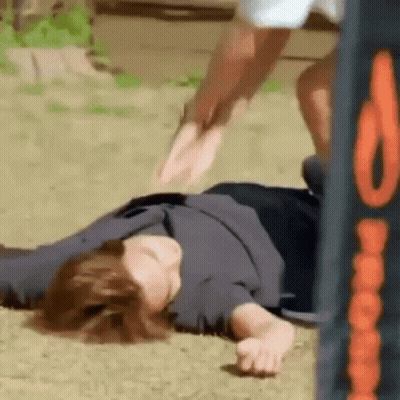 Person Laying On Ground Jumped Over GIF