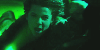 Person Laying On Ground With Green Light GIF