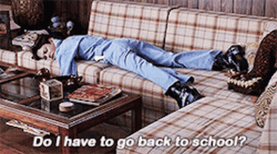 Person Laying On Plaid Couch Saying Do I Have To Go Back To School GIF