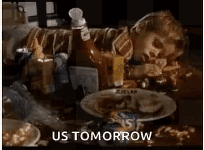 Person Laying On Table With Plate Of Food GIF