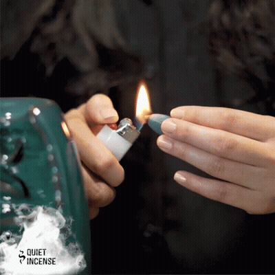 Person Lighting Candle With Quiet Incense Logo GIF