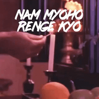 Person Lighting Candle With Text Nam Myoho Renge Kyo GIF