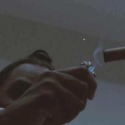 Person Lighting Cigar GIF