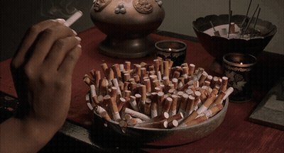 Person Lighting Cigarette GIF