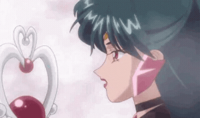 Person Looking At Heart Shaped Pendant GIF