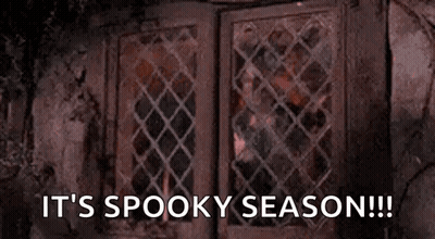 Person Looking Out Window It's Spooky Season GIF