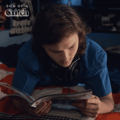 Person Lying In Bed Reading Son Of A Grifch GIF