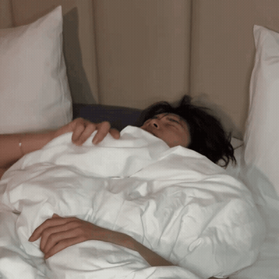 Person Lying In Bed With White Blanket GIF