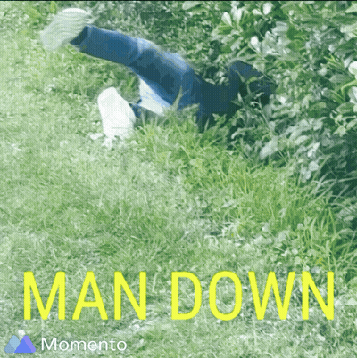 Person Lying In Grass Saying Man Down GIF