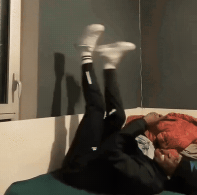 Person Lying On Back With Adidas Pants GIF