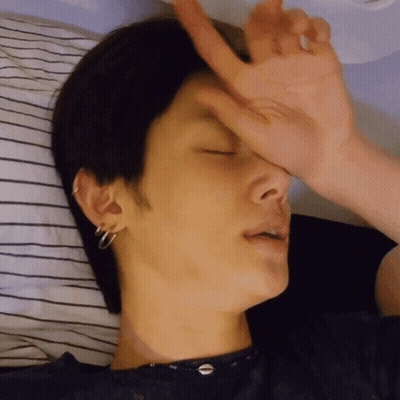 Person Lying On Bed Hand On Face GIF