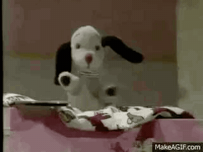 Person Lying On Bed With Blanket And Book GIF