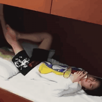 Person Lying On Bed With Feet Up GIF