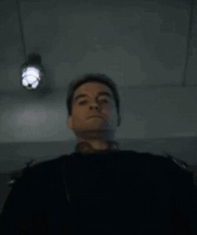 Person Lying On Bed With Light On Head GIF