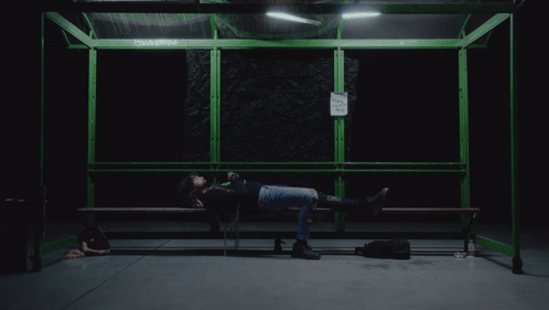 Person Lying On Bench Near No Smoking Sign GIF