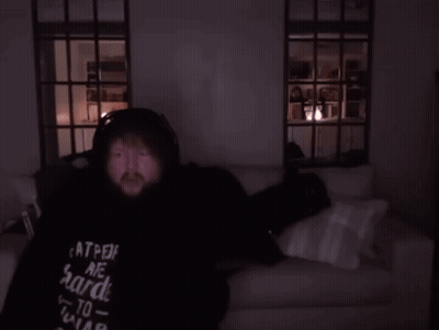 Person Lying On Couch In Dark Room GIF
