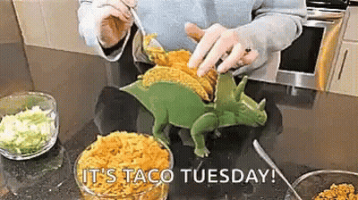 Person Making Dinosaur-Shaped Taco GIF