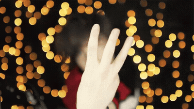 Person Making Peace Sign GIF