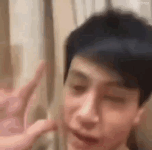 Person Making Peace Sign GIF