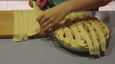 Person Making Pie With Pastry Strips GIF